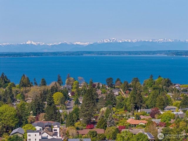 bird's eye view with a water and mountain view