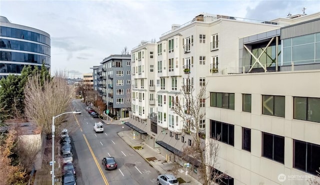 view of building exterior with uncovered parking