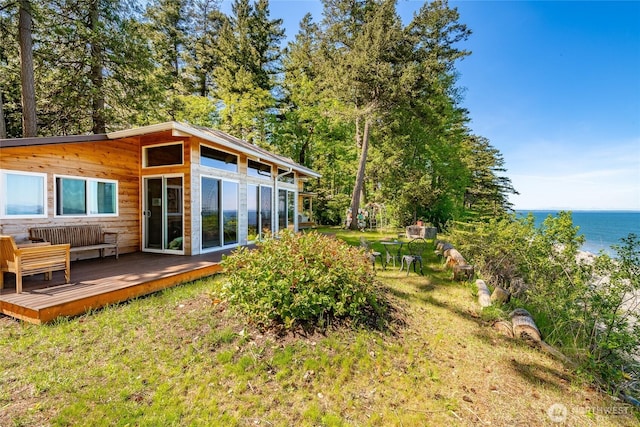 60 Eliza Is, Bellingham, WA 98226 - exterior space featuring a lawn and a deck with water view