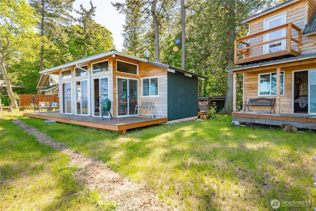 60 Eliza Is, Bellingham, WA 98226 - back of property featuring a wooden deck and a yard