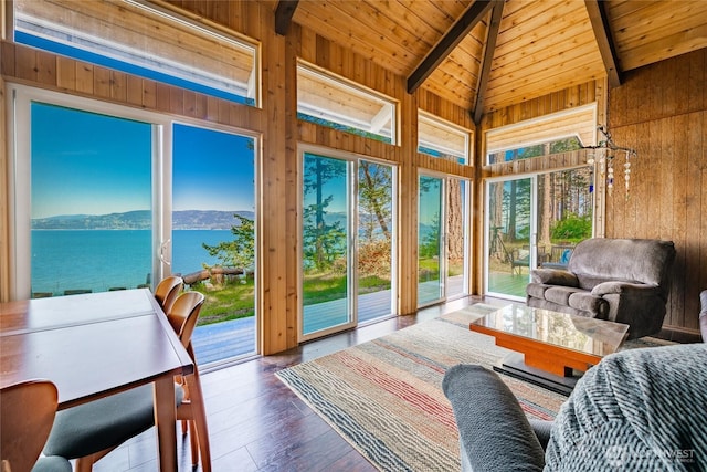 60 Eliza Is, Bellingham, WA 98226 - sunroom / solarium with wood ceiling, a water and mountain view, wood walls, wood finished floors, and vaulted ceiling with beams