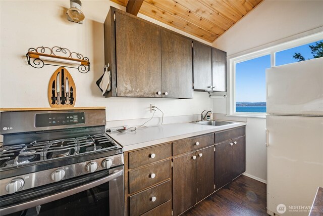 60 Eliza Is, Bellingham, WA 98226 - kitchen with freestanding refrigerator, wooden ceiling, stainless steel range with gas stovetop, a sink, and dark wood finished floors