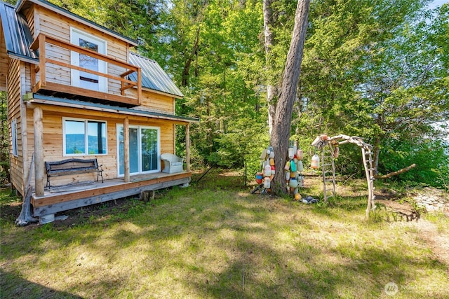 60 Eliza Is, Bellingham, WA 98226 - rear view of property with a yard, a deck, metal roof, and a balcony