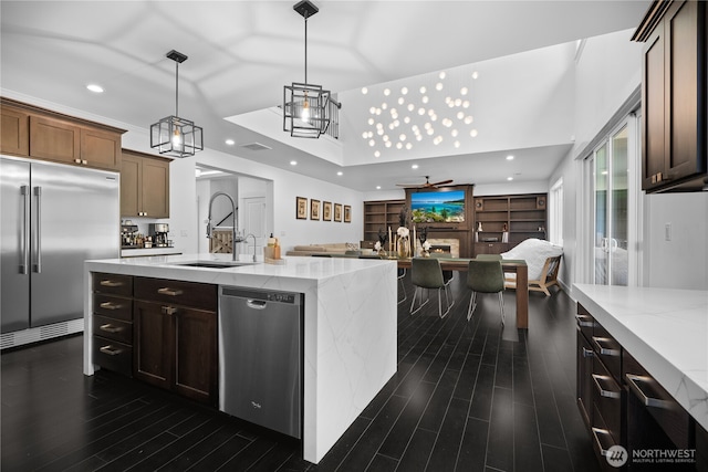 18723 133rd Street Ct E, Bonney Lake, WA 98391 - kitchen featuring recessed lighting, stainless steel appliances, a sink, open floor plan, and dark wood-style flooring