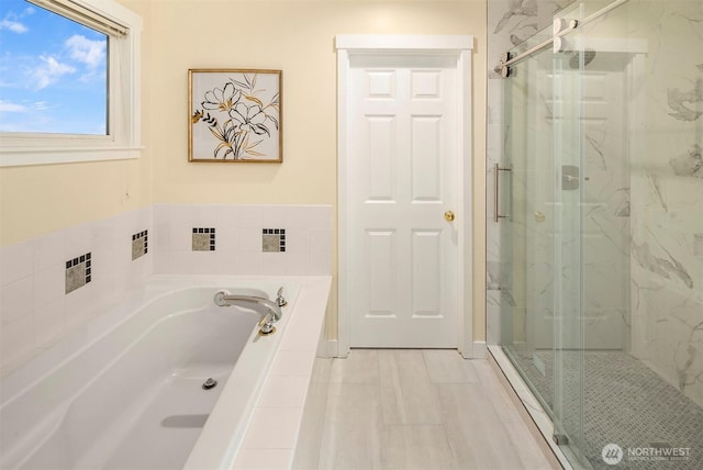 full bath with a bath and a marble finish shower
