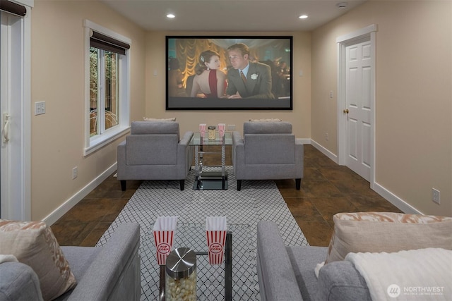 home theater with recessed lighting and baseboards