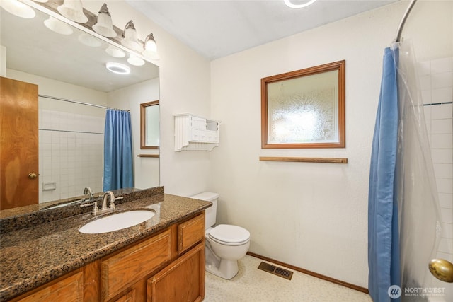 bathroom featuring visible vents, vanity, toilet, baseboards, and a shower with shower curtain