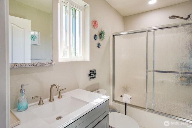 4647 Ohio St, Longview, WA 98632 - bathroom featuring vanity, toilet, and bath / shower combo with glass door