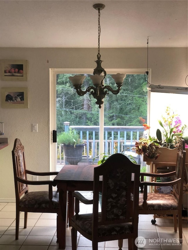 90 E Connemara, Shelton, WA 98584 - dining room featuring healthy amount of natural light, tile patterned flooring, and baseboards