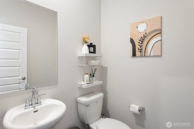 bathroom with a sink and toilet