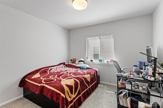 carpeted bedroom featuring baseboards