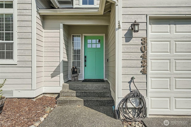 doorway to property featuring a garage