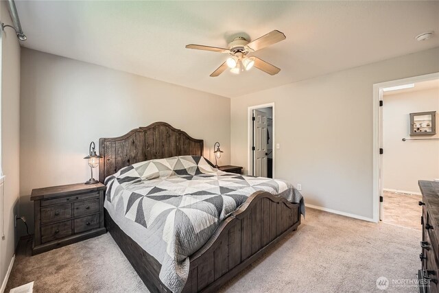 carpeted bedroom with baseboards and ceiling fan