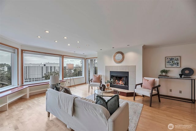 1028 Lakeview Blvd E Unit 6, Seattle, WA 98102 - living room with a fireplace, light wood-style flooring, ornamental molding, and recessed lighting