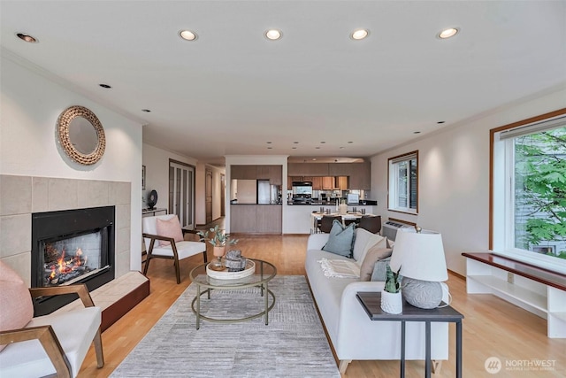 1028 Lakeview Blvd E Unit 6, Seattle, WA 98102 - living room with a fireplace, light wood-type flooring, and recessed lighting