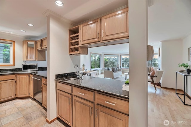 1028 Lakeview Blvd E Unit 6, Seattle, WA 98102 - kitchen with ornamental molding, dark stone counters, appliances with stainless steel finishes, and a sink