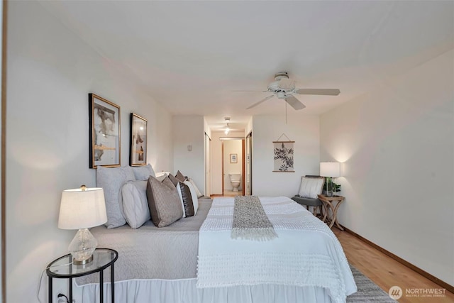 1028 Lakeview Blvd E Unit 6, Seattle, WA 98102 - bedroom featuring connected bathroom, wood finished floors, baseboards, and ceiling fan