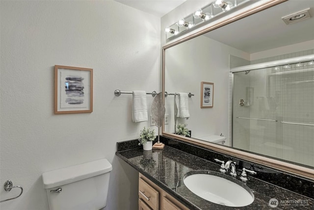 1028 Lakeview Blvd E Unit 6, Seattle, WA 98102 - bathroom with toilet, a shower with door, and vanity