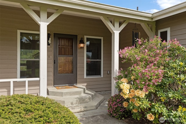 property entrance with covered porch