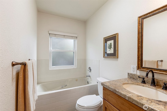 bathroom featuring a bath, toilet, and vanity