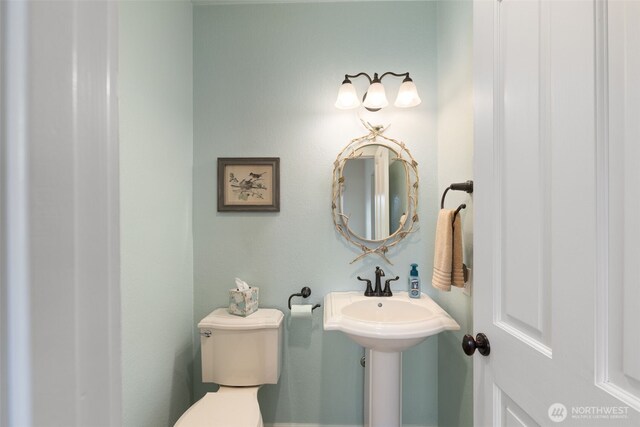 half bathroom with toilet