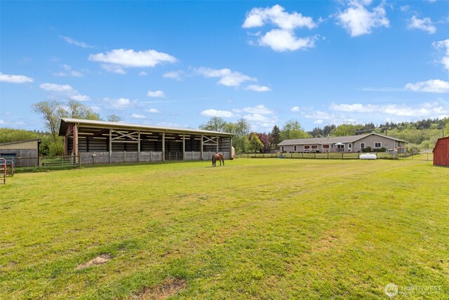 view of yard with an exterior structure and an outbuilding