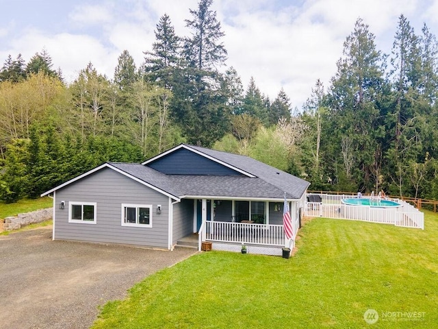 4 Dakota Ln, Elma, WA 98541 - ranch-style home with an outdoor pool, a shingled roof, driveway, a porch, and a front yard