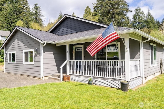 4 Dakota Ln, Elma, WA 98541 - view of front of property featuring crawl space, covered porch, a front yard, and roof with shingles