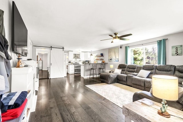 4 Dakota Ln, Elma, WA 98541 - living area featuring a ceiling fan, dark wood finished floors, and a barn door