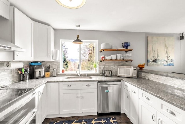 4 Dakota Ln, Elma, WA 98541 - kitchen featuring wall chimney range hood, a sink, dishwasher, white microwave, and white cabinetry