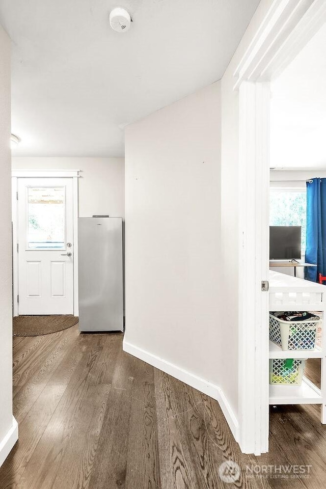 4 Dakota Ln, Elma, WA 98541 - corridor with wood finished floors, a healthy amount of sunlight, and baseboards