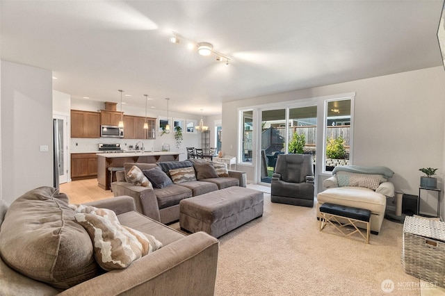 living area with light colored carpet