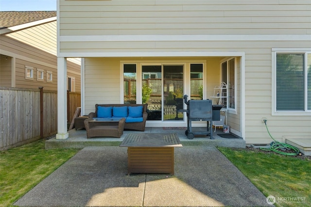 view of patio with an outdoor living space and fence