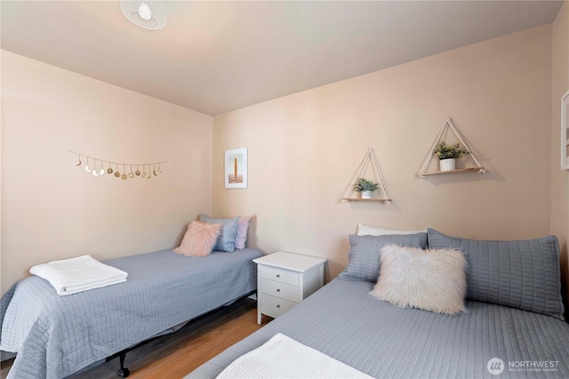 bedroom featuring wood finished floors