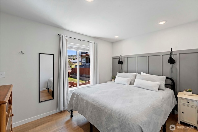 bedroom with light wood-style flooring and recessed lighting