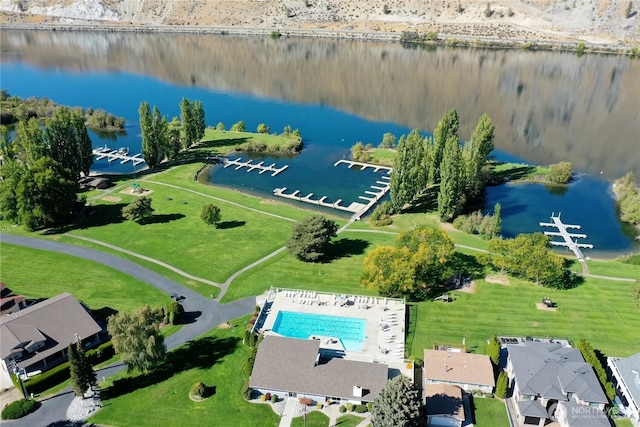 birds eye view of property with a water view