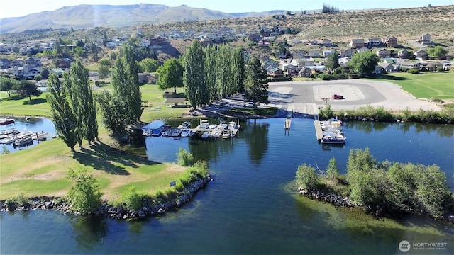 bird's eye view featuring a residential view and a water and mountain view