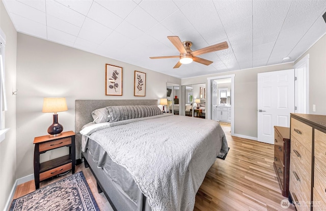 2376 Forest View Dr, Bellingham, WA 98229 - bedroom featuring light wood finished floors, a ceiling fan, and ensuite bathroom