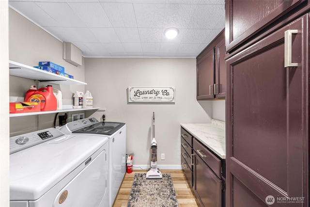 2376 Forest View Dr, Bellingham, WA 98229 - laundry area with washer and clothes dryer, cabinet space, and light wood-type flooring