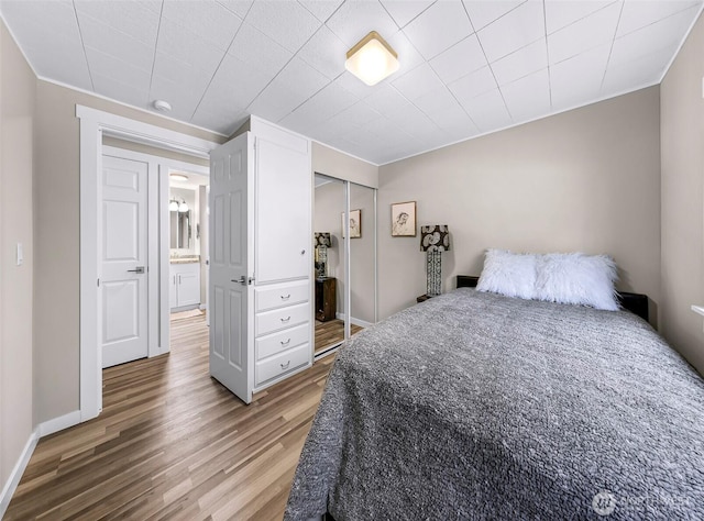 2376 Forest View Dr, Bellingham, WA 98229 - bedroom featuring ornamental molding, light wood-type flooring, and a closet