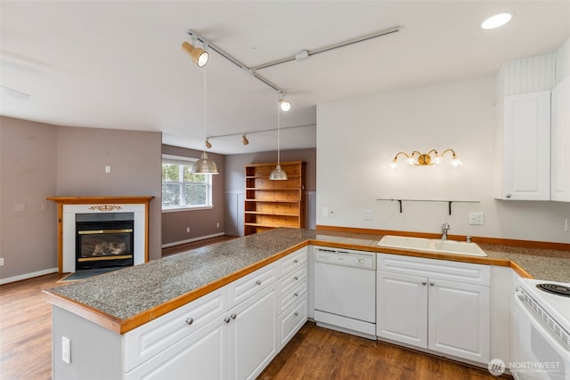 350 Castellano Way Unit 204, Port Townsend, WA 98368 - kitchen featuring tile counters, a sink, white cabinets, white appliances, and rail lighting