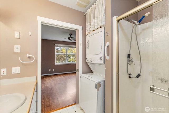350 Castellano Way Unit 204, Port Townsend, WA 98368 - laundry area featuring a ceiling fan, a sink, stacked washer / drying machine, visible vents, and laundry area