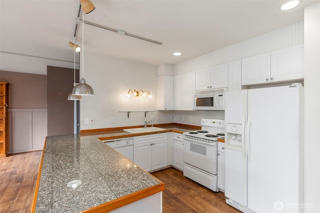 350 Castellano Way Unit 204, Port Townsend, WA 98368 - kitchen featuring white cabinets, tile countertops, a sink, white appliances, and a peninsula