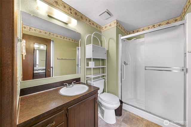 full bathroom with a shower stall, tile patterned flooring, visible vents, toilet, and vanity