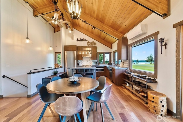 335 Blakely Dr, Blakely Island, WA 98222 - dining area featuring a wall unit AC, wood ceiling with exposed beams, light wood-type flooring, ceiling fan, and baseboards