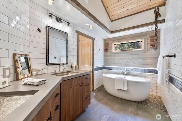 335 Blakely Dr, Blakely Island, WA 98222 - full bath featuring a soaking tub, double vanity, tile walls, and lofted ceiling
