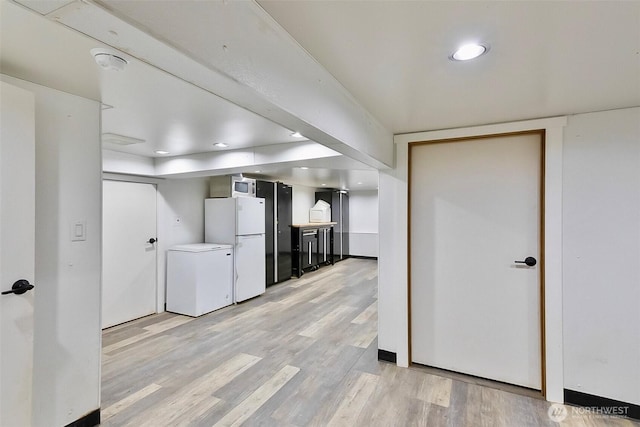 335 Blakely Dr, Blakely Island, WA 98222 - kitchen featuring fridge, freestanding refrigerator, light wood-style floors, recessed lighting, and stainless steel microwave