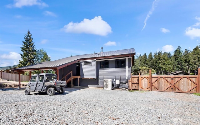 335 Blakely Dr, Blakely Island, WA 98222 - view of front of home featuring metal roof, a cooling unit, and a carport