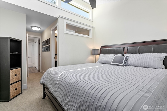carpeted bedroom featuring baseboards