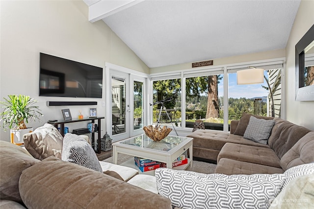 living area featuring lofted ceiling with beams